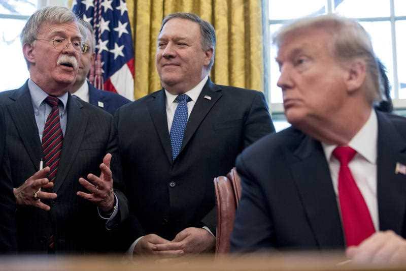 National security adviser John Bolton, accompanied by Secretary of State Mike Pompeo, and President Donald Trump.
