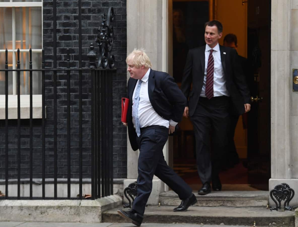 File image of Boris Johnson and then Health Secretary Jeremy Hunt leave Number 10 
