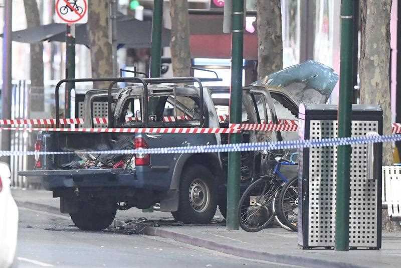 The alleged attacker's burnt out vehicle on Bourke Street in Melbourne.