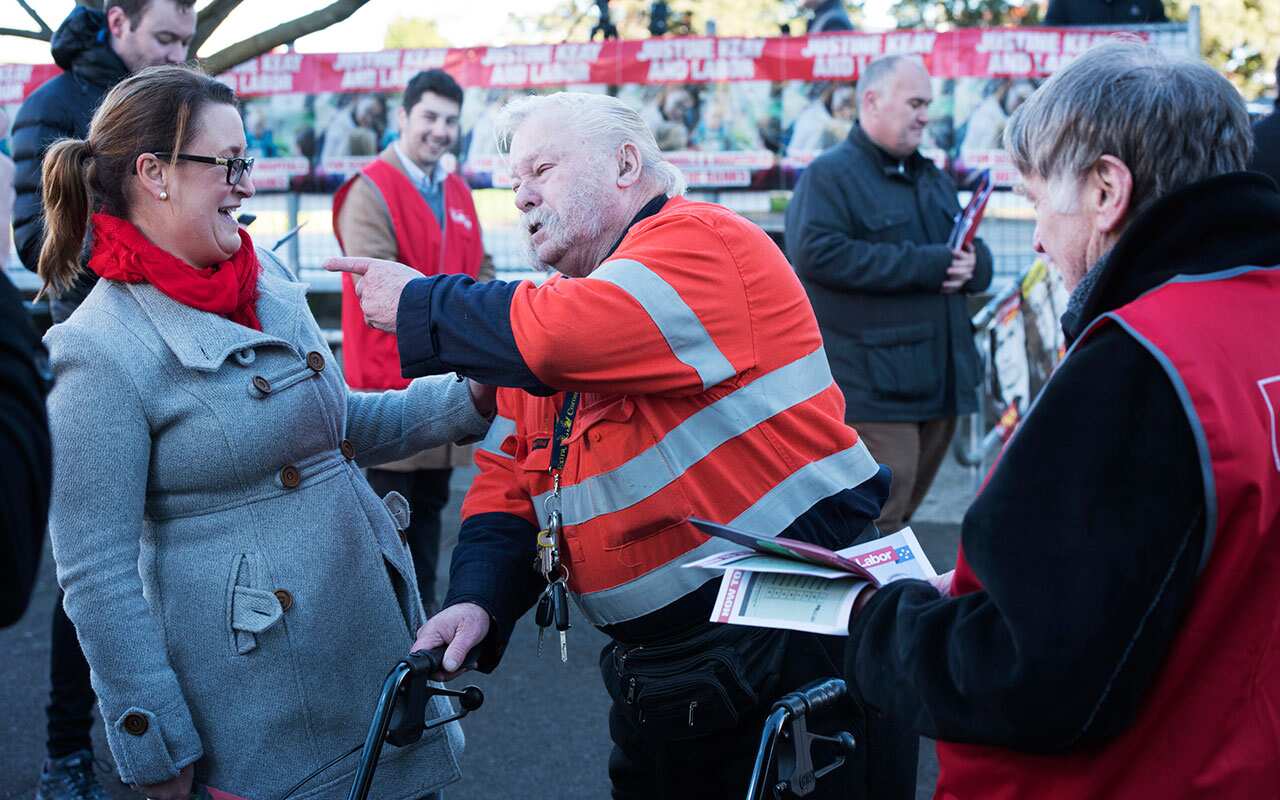 Labor candidate for Braddon Justine Keay (left) speaks to voters at Nixon Street Public School in Devonport, Saturday, July 28, 2018.