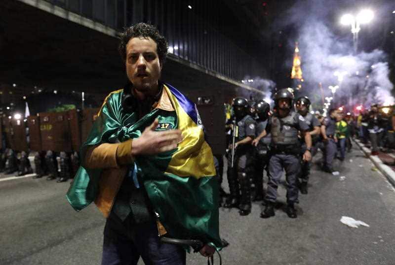 Supporters of Brazilian far-right presidential candidate Jair Bolsonaro celebrate his victory at the Paulista Avenue in Sao Paulo.