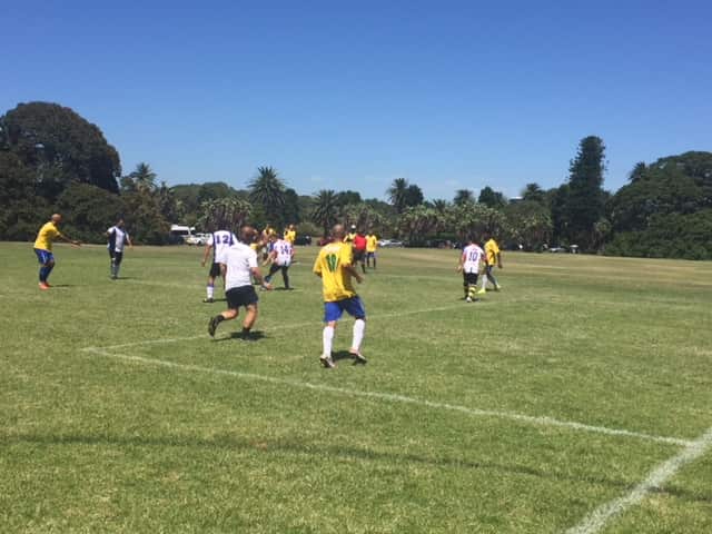 Footballers take part in the 2018 Les Murray Cup at Brazilian Fields in Sydney's Centennial Park.