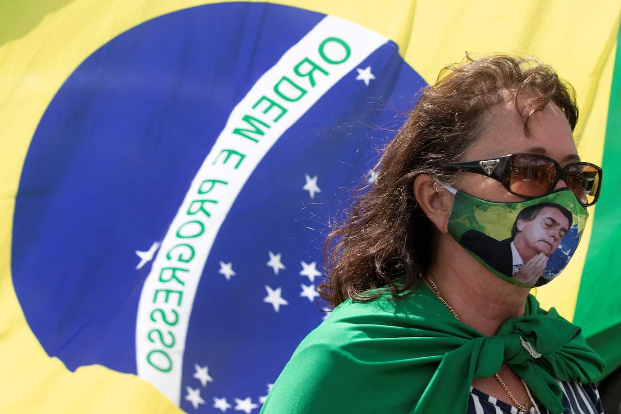 A supporters of Brazilian President Jair Bolsonaro attends a rally in Brasilia, Brazil, 19 April 2020.