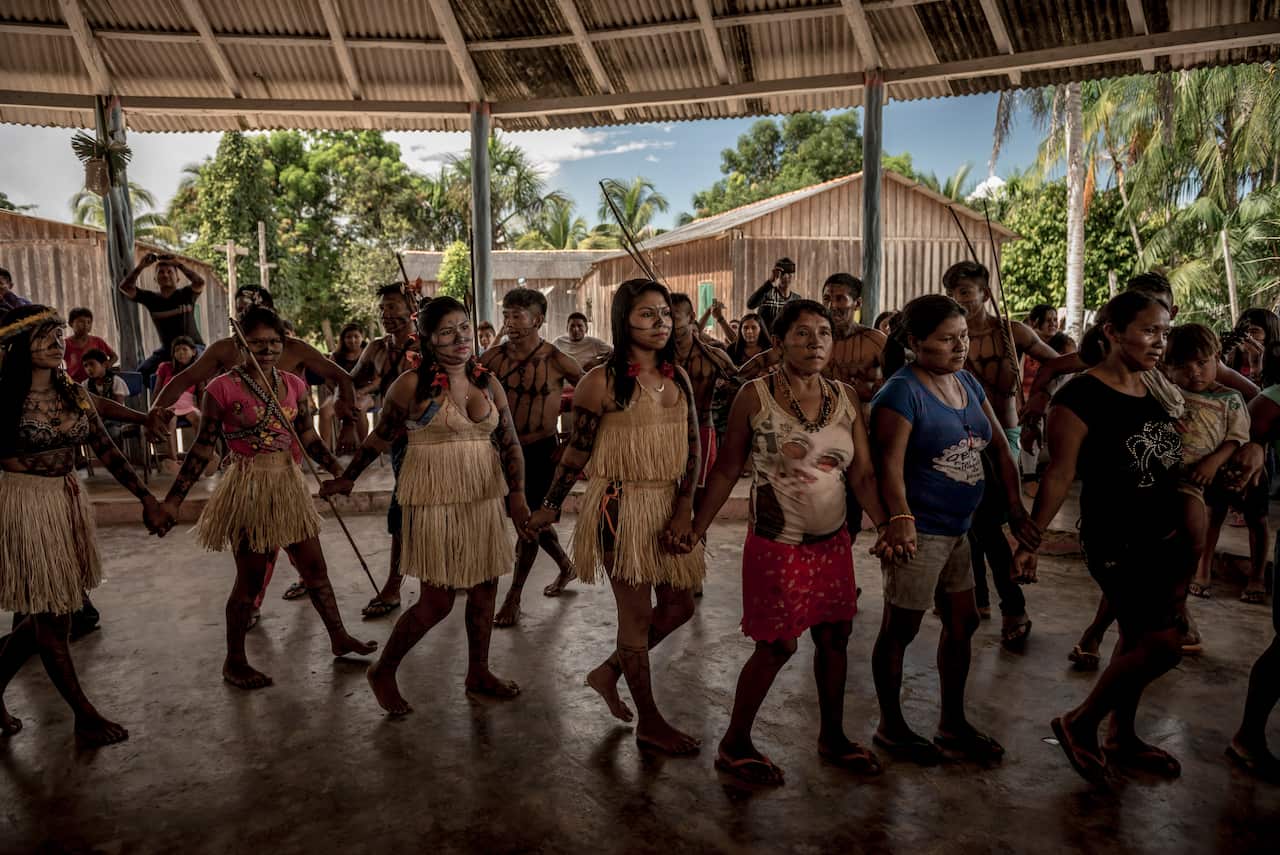 Members of the indigenous Munduruku tribe perform a traditional ceremonial dance at the start of a rare three-day assembly of Munduruku from many villages in the Amazon rainforest in Brazil.