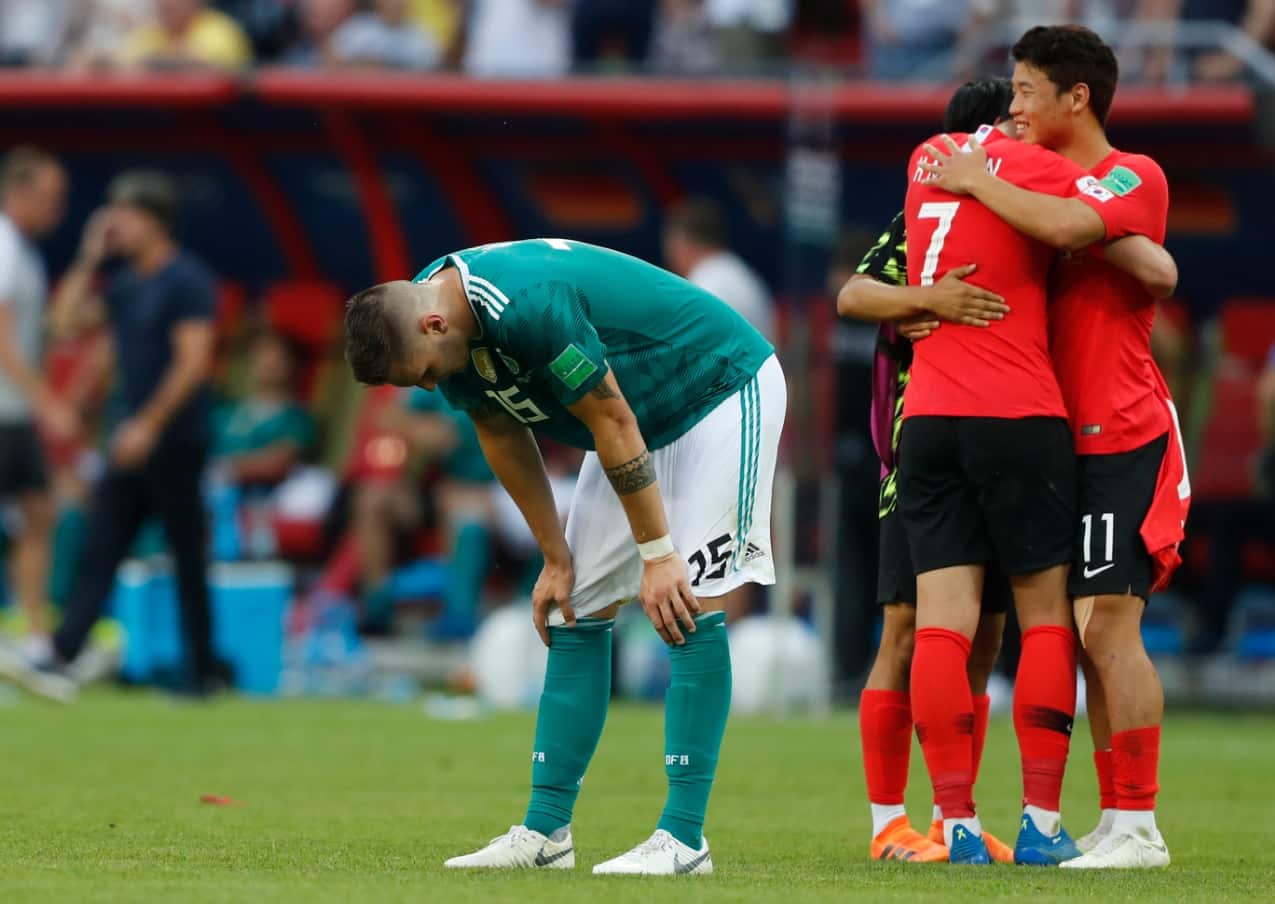 Germany's Niklas Suele, left, is dejected as South Korea's Son Heung-min, right, celebrates after the group F match between South Korea and Germany