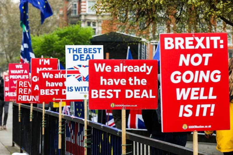 Brexit protest placards are seen outside the Houses of Parliament.