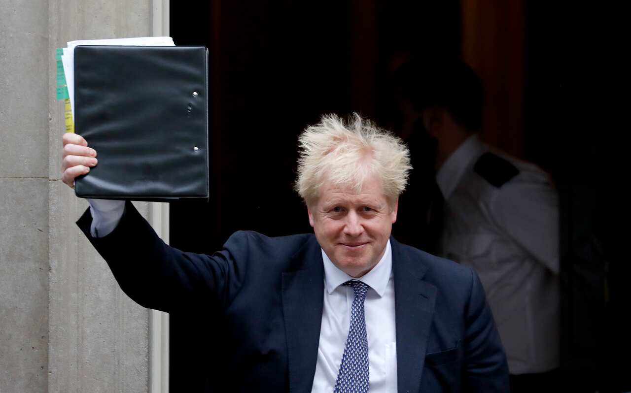 Britain's Prime Boris Johnson leaves 10 Downing Street to attend the weekly Prime Ministers' Questions session.