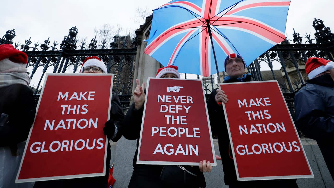 Pro Brexit demonstrators hold banners outside Parliament. The divorce deal is all but done now. 