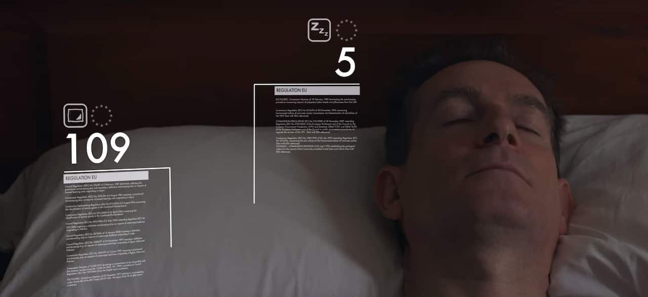 A man sleeping on a pillow, eu regulation info-graphics surround him
