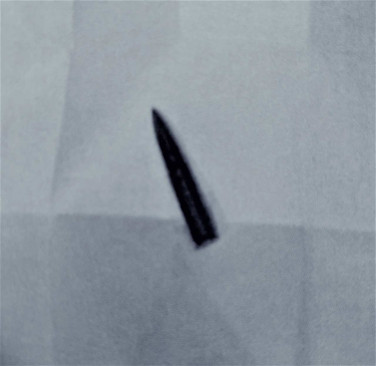 A photograph of the large calibre bullet Dhafer found at his door.