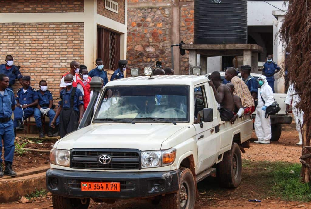 Injured people are transferred after a fire at the central prison in Gitega, on 7 December, 2021.