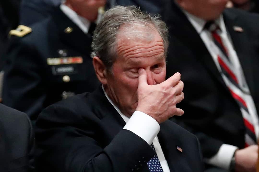 Former President George W. Bush wipes an eye at the State Funeral for his father, former President George H.W. Bush, at the National Cathedral, Wednesday, Dec. 5, 2018, in Washington. (AP Photo/Alex Brandon, Pool)