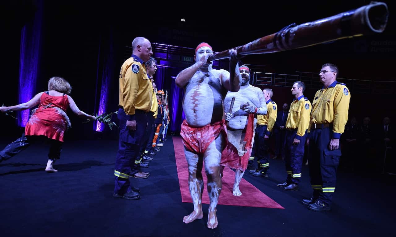 Aboriginal dancers perform during a Bushfire State Memorial at Qudos Bank Arena in Sydney, Sunday, February 23, 2020.