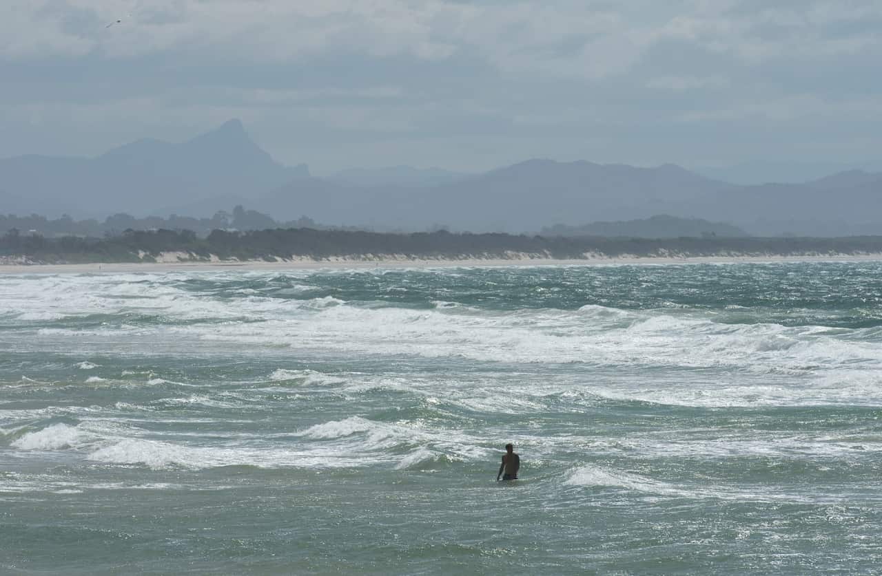 A swimmer is seen near Clarkes Beach at Byron Bay.