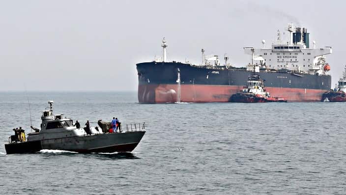 Iran military guard and oil tanker at Persian Gulf