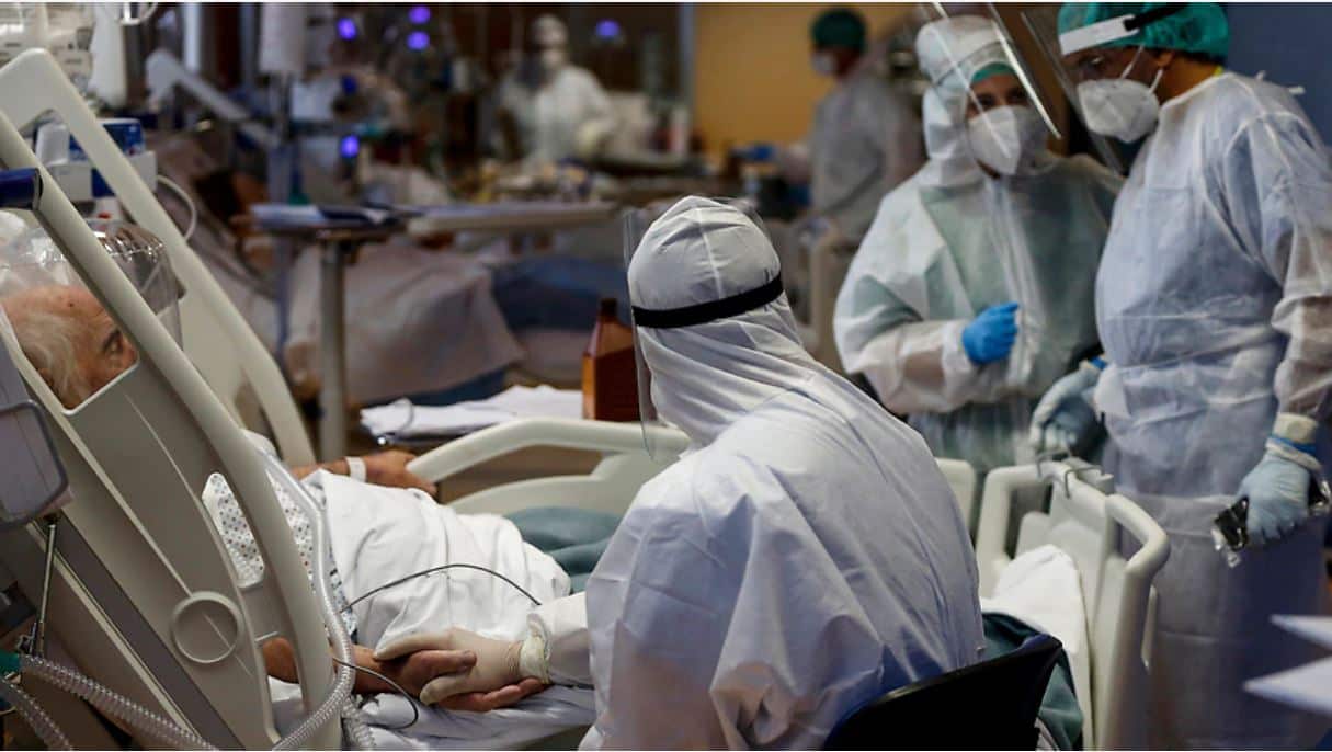 Health workers attend to a COVID-19 patient at one of the intensive care units in Italy. 