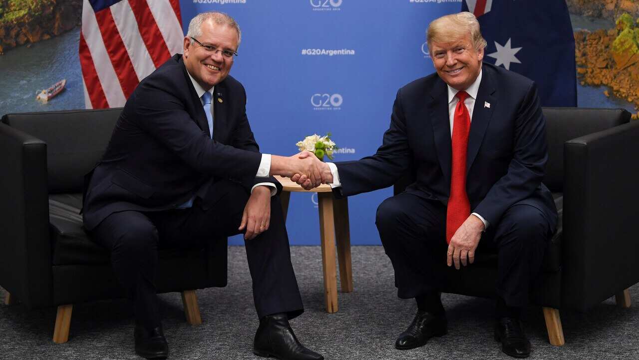 Scott Morrison shakes hands with Donald Trump.