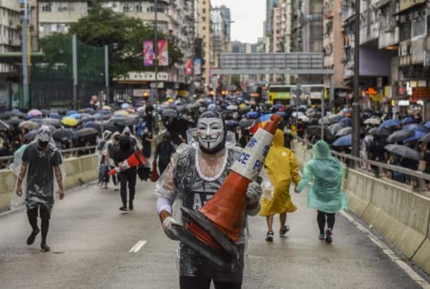 Protesters in Hong Kong during a demonstration against a new law banning face masks in public AAP