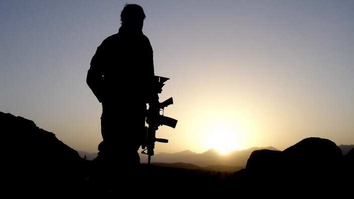 An Australian Special Operations Task Group soldier observing the valley during the Shah Wali Kot Offensive. 