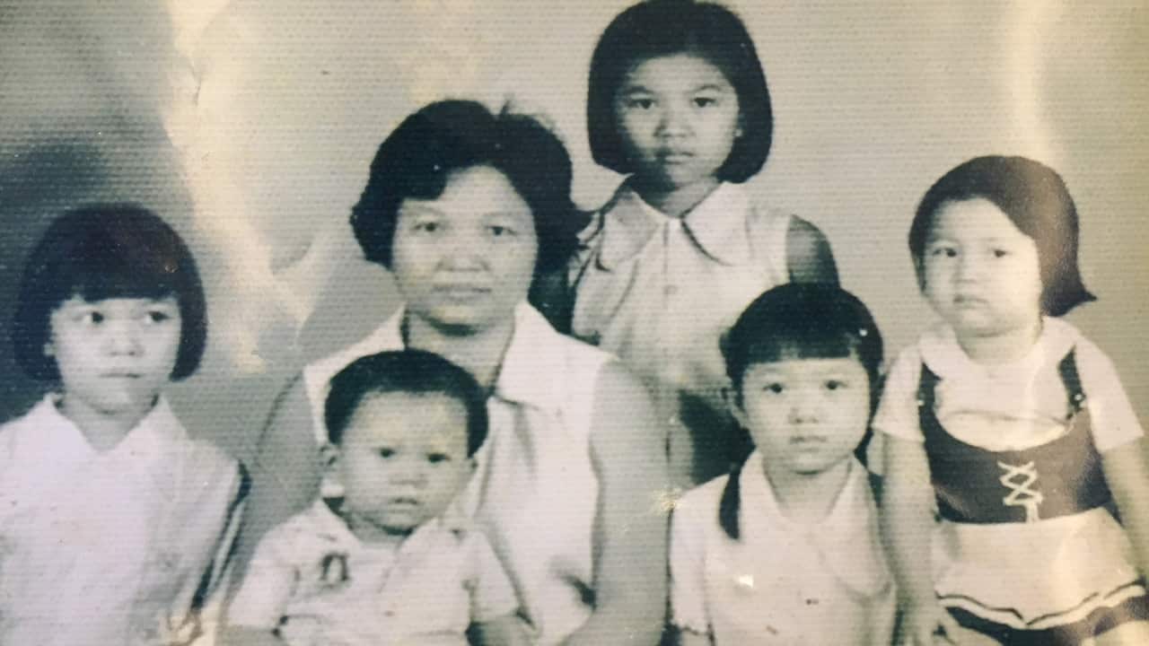 Hong and Bo (both right) with their family before they were forcibly separated from each other by the Khmer Rouge.