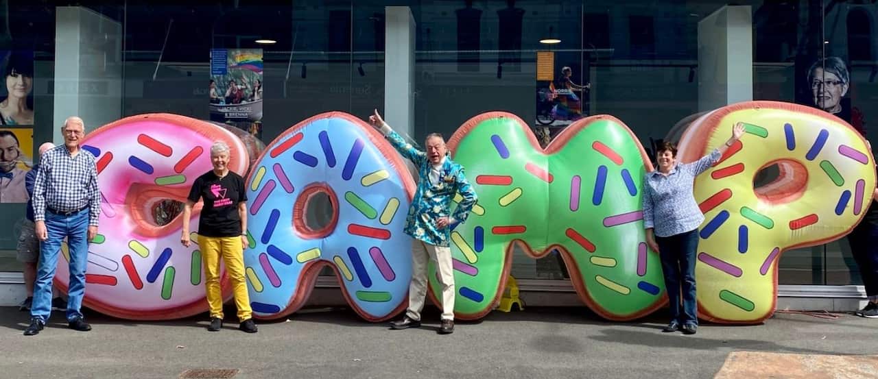 Peter de Waal (Centre Right) and Robyn Kennedy (Right) celebrate 50 years since CAMP Ink was founded. 