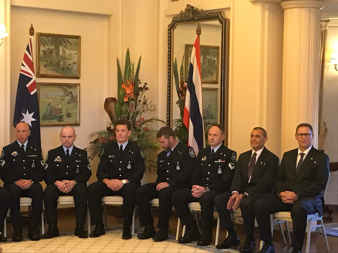 The nine Australians gathered in Government House ahead of the ceremony.