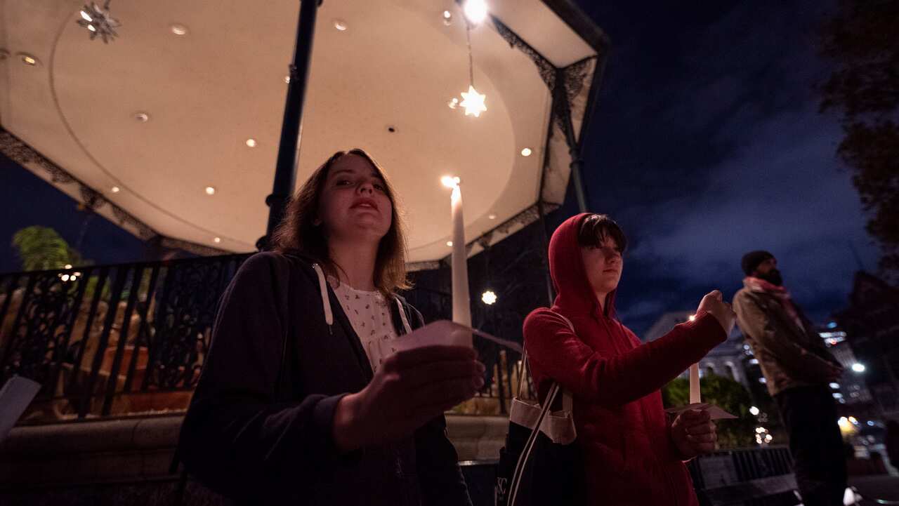 People attend a vigil in memory of Jakelin Caal, a 7-year-old Guatemalan girl who died while in US Border Patrol custody.  