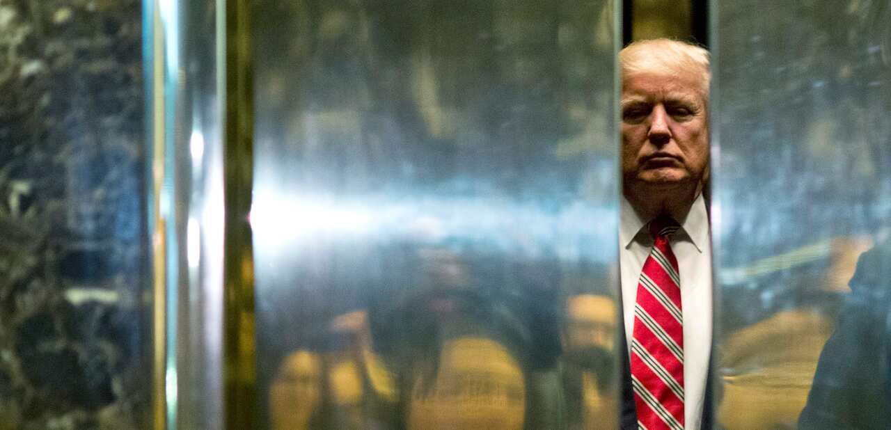 US President-elect Donald Trump boards the elevator in Trump Tower in New York City, Jan 16, 2017.