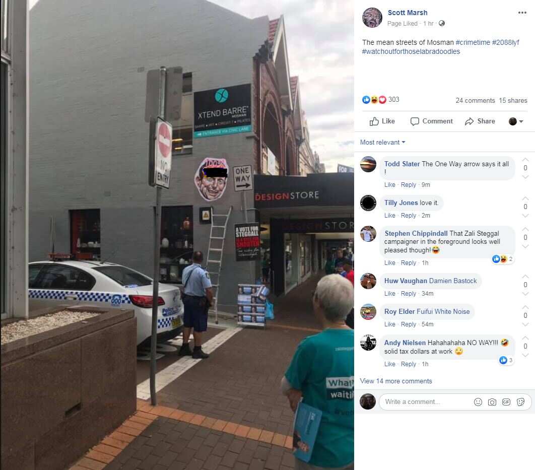 The posters featuring an offensive word on Tony Abbott's face have been removed. 