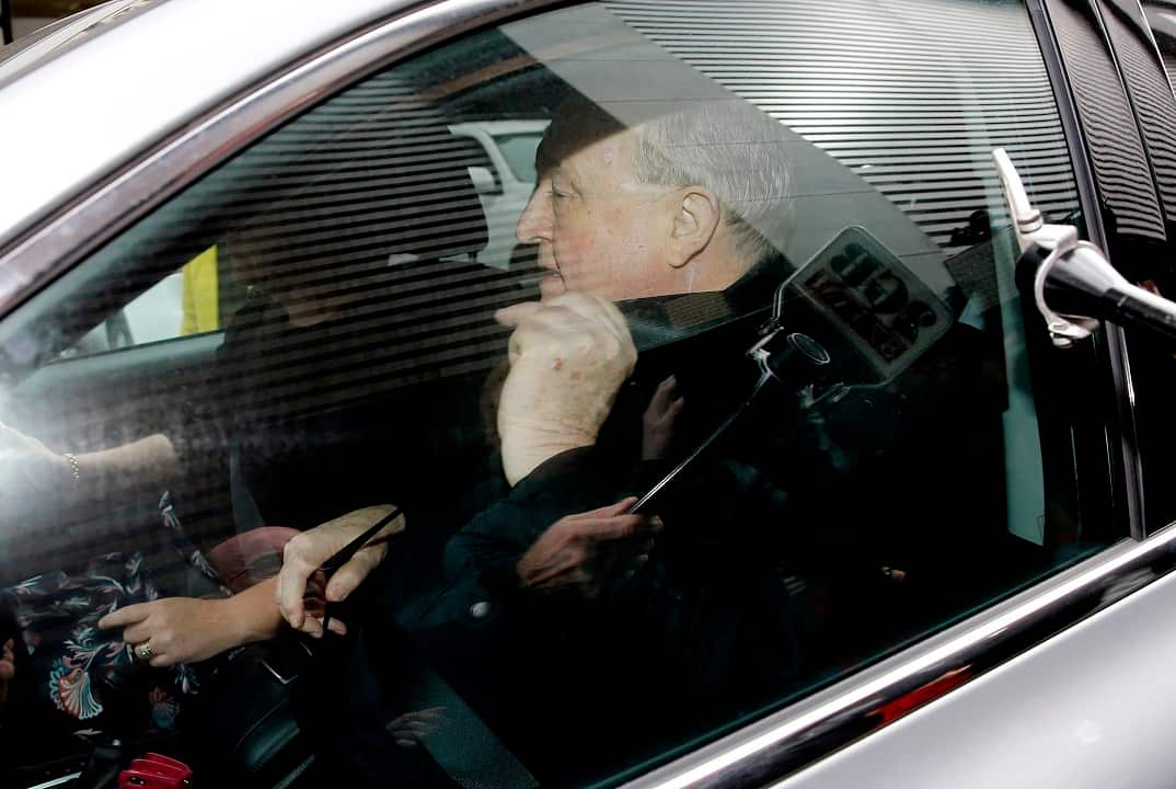 Archbishop Philip Wilson leaves Newcastle Local Court.