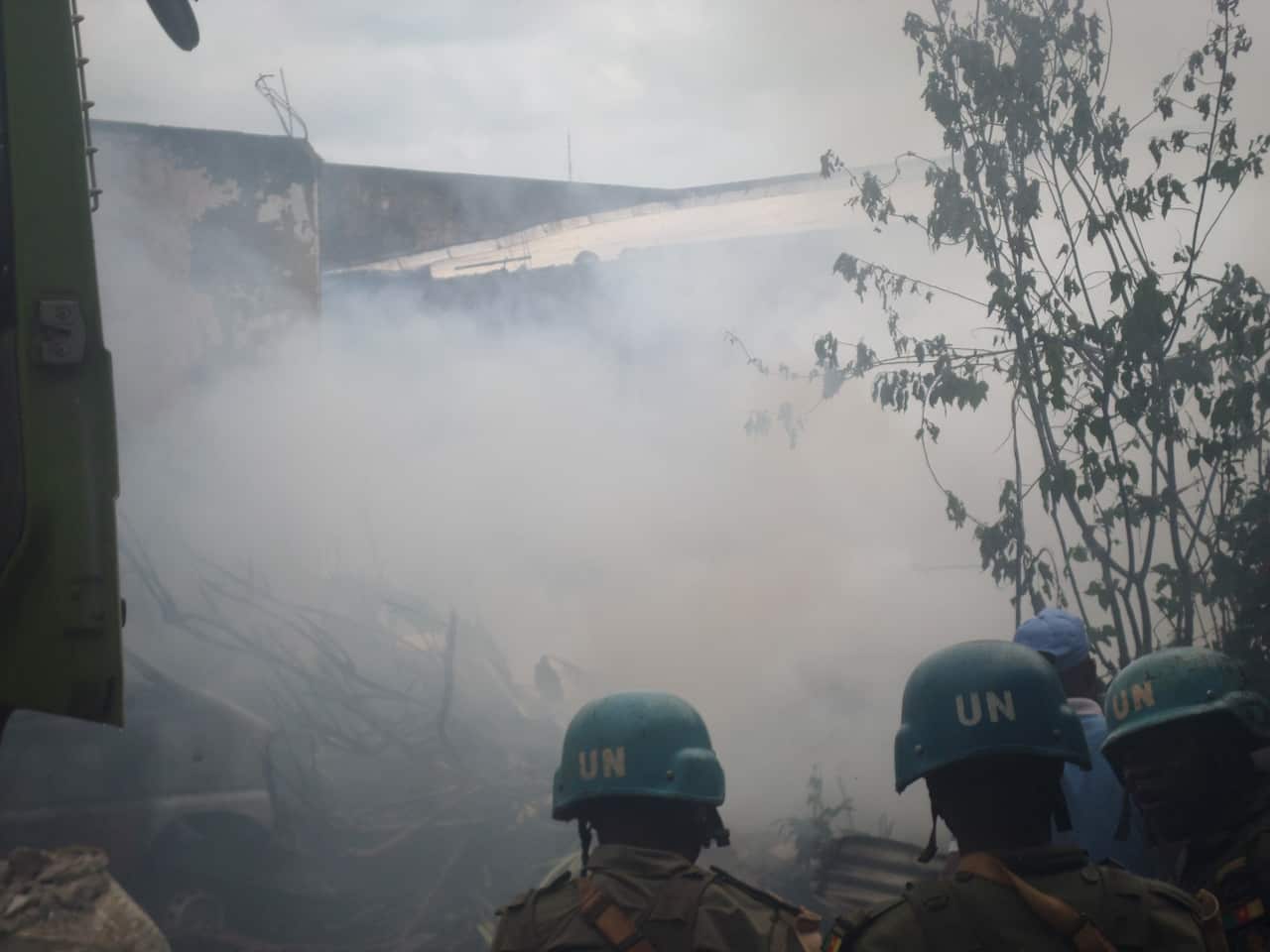 Soldiers of the United Nations Mission in Central African Republic try to extinguish the fire in Bangui following unrest (AAP).