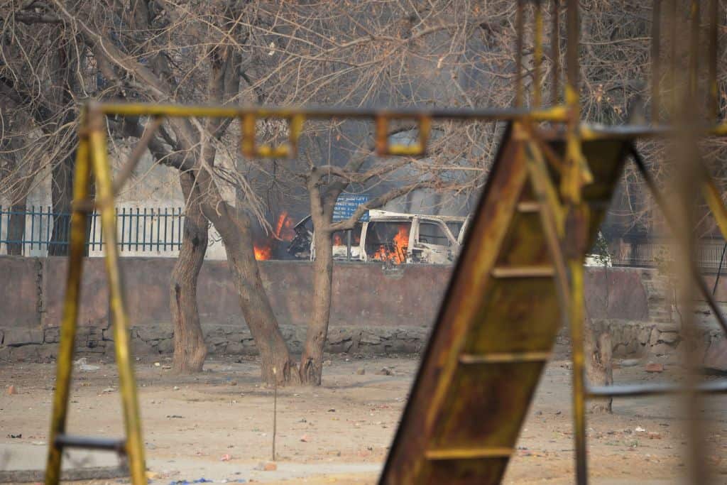 A vehicle burns near a playground next to an office of the British charity Save the Children during an ongoing attack in Jalalabad on January 24, 2018.