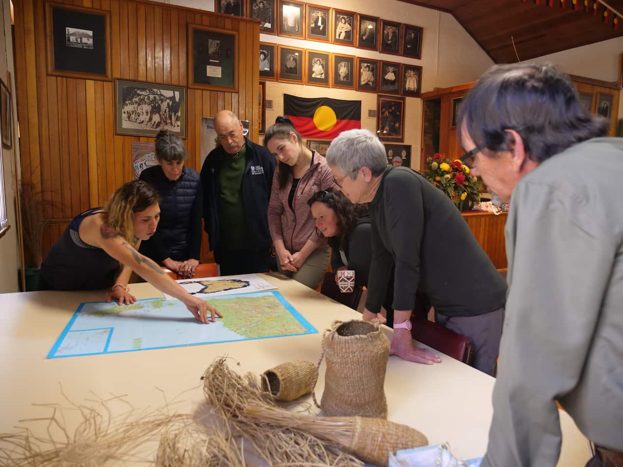 wukalina walk guide Carleeta Thomas showing guests a map of the area they will be walking on.