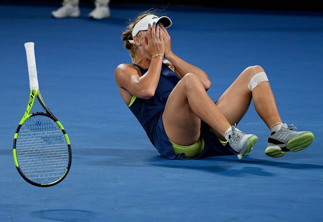 January 27: Denmark's Caroline Wozniacki celebrates after defeating Romania's Simona Halep to win the women's singles final at the Australian Open.