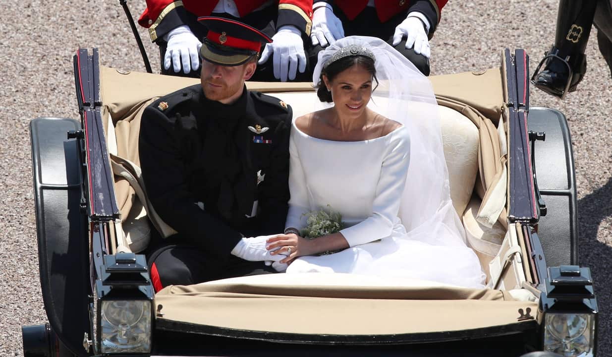 Prince Harry and Meghan Markle ride in an Ascot Landau along the Long Walk after their wedding.