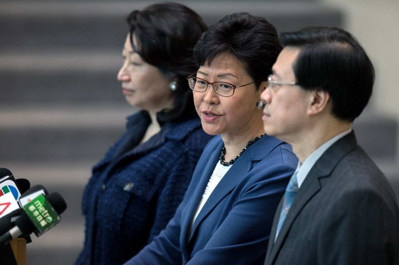Hong Kong Chief Executive Carrie Lam (C) says she will not withdraw the controversial extradition bill or resign as chief executive, despite mass protests.