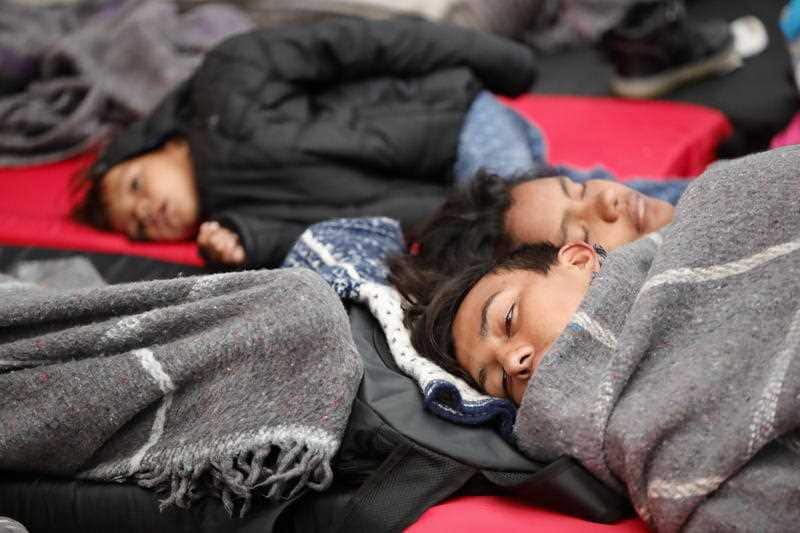People of the migrant caravan rest in the sports center Jesus Martinez Palillo, in Mexico City, Mexico.Migrants pause to sleep and rest in Mexico City, Mexico, on their way to the US border from South America.
