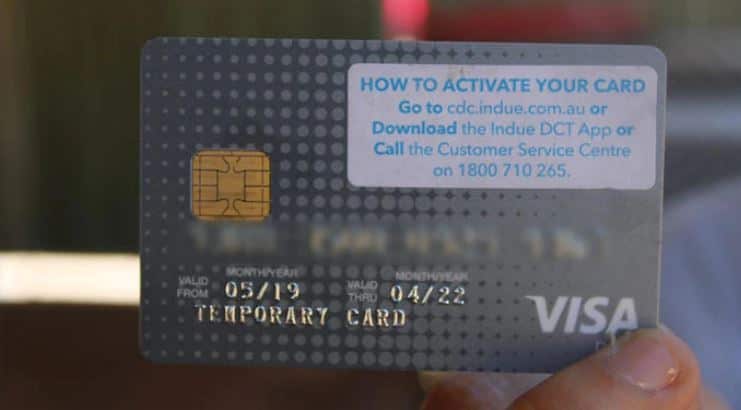 A person holding a bank card.