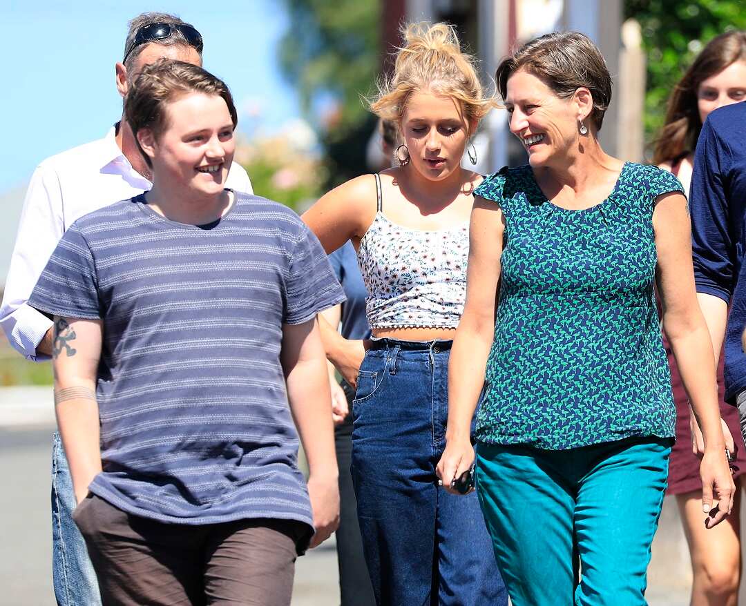 Tasmanian Greens leader Cassy O'Connor (right) arrives with family to vote in the Tasmanian State Election at Goulburn Street Primary School, West Hobart, Saturday, March 3, 2018. (AAP Image/Rob Blakers) NO ARCHIVING