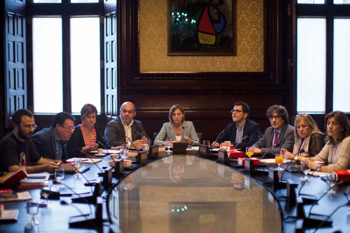 President of the Catalan parliament Carme Forcadell, center, attends a meeting with parliament representatives at the Catalonia Parliament in Barcelona.