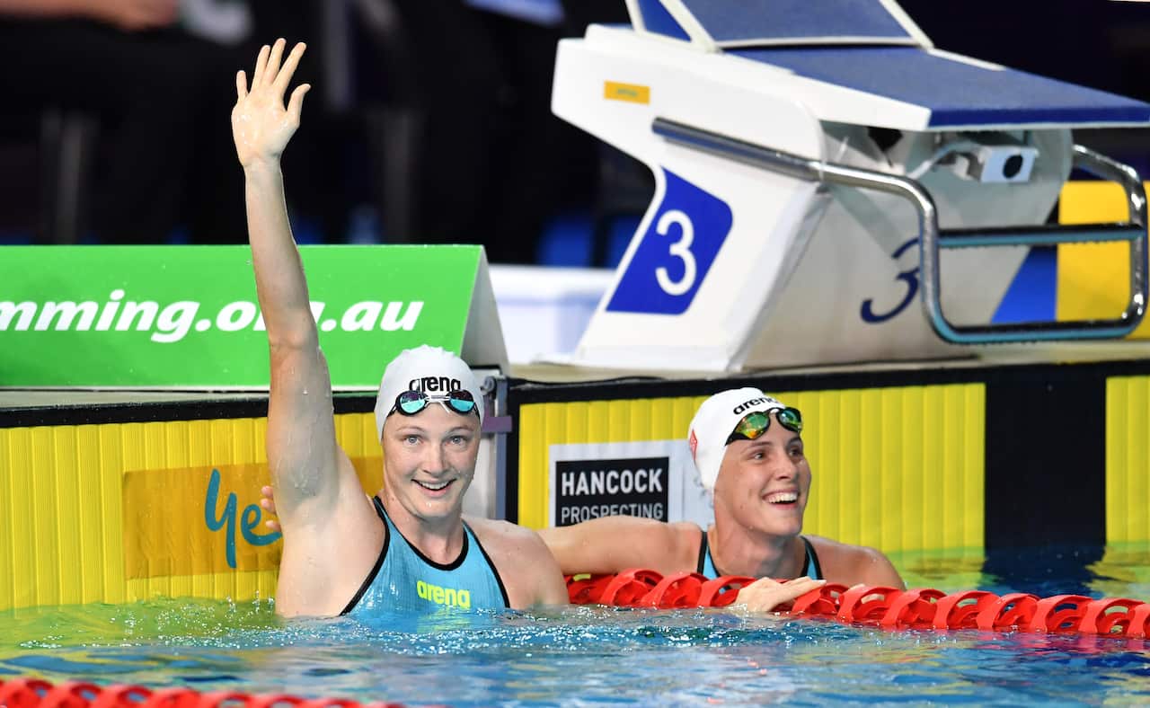 Cate Campbell (left) celebrates with her sister Bronte Campbell after winning the final of the womens 50 metre freestyle on day four.