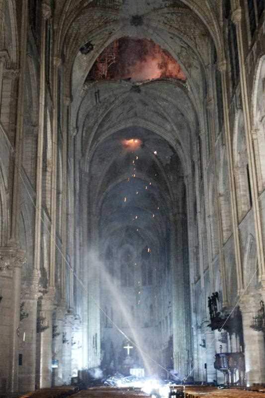 The interior of the cathedral as emergency services continue to work. The two towers and facade have been saved. 