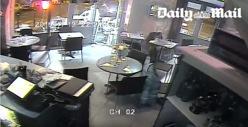 Security camera footage showing a gunman outside a Paris restaurant.