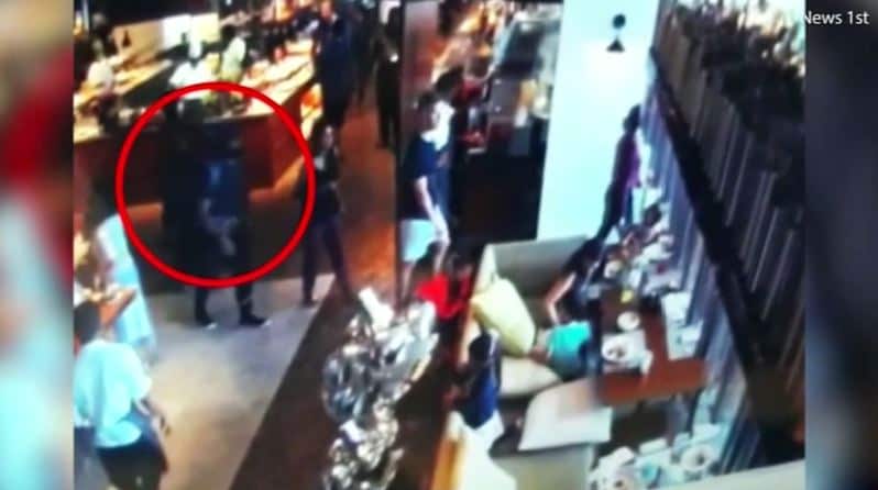 One of the suicide bombers at the Shangri la Hotel walking next to Haneke Manoharan minutes before he is believed to have detonated his backpack. 