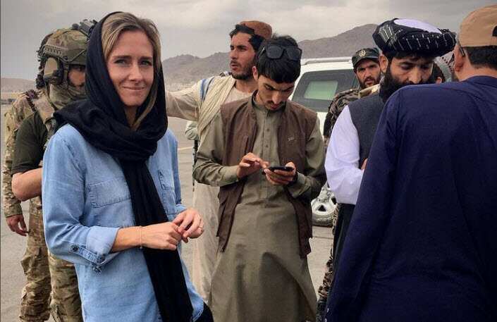 Charlotte Bellis with Taliban officials in September, 2021.