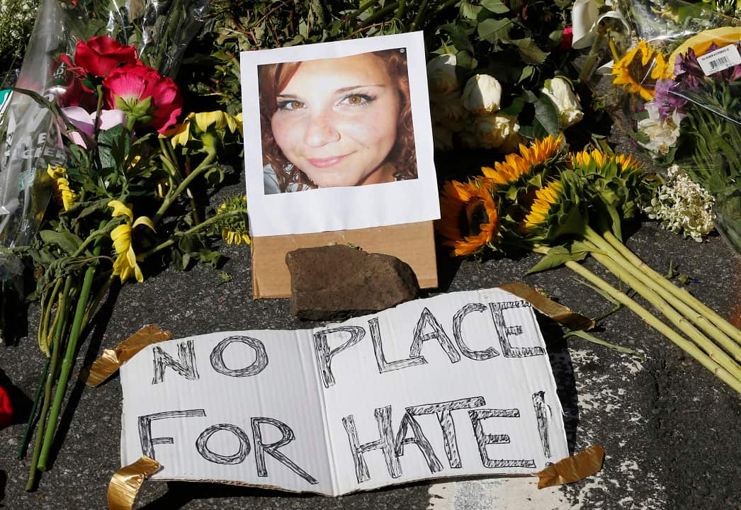 A makeshift memorial of flowers and a photo of the victim of the car attack is on display at the attack site  in Charlottesville.