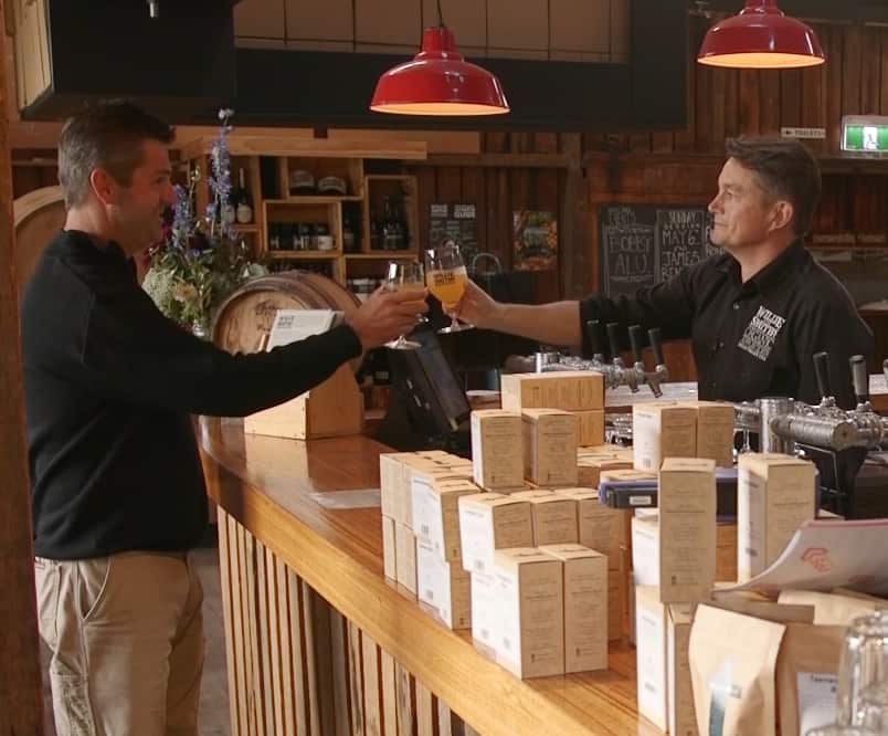 Co-founders Andrew Smith and Sam Reid of Willie Smith's Cider sharing a drink.