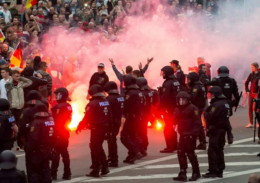 August 27, 2018: Protesters light fireworks during a far-right demonstration in Chemnitz, Germany. 
