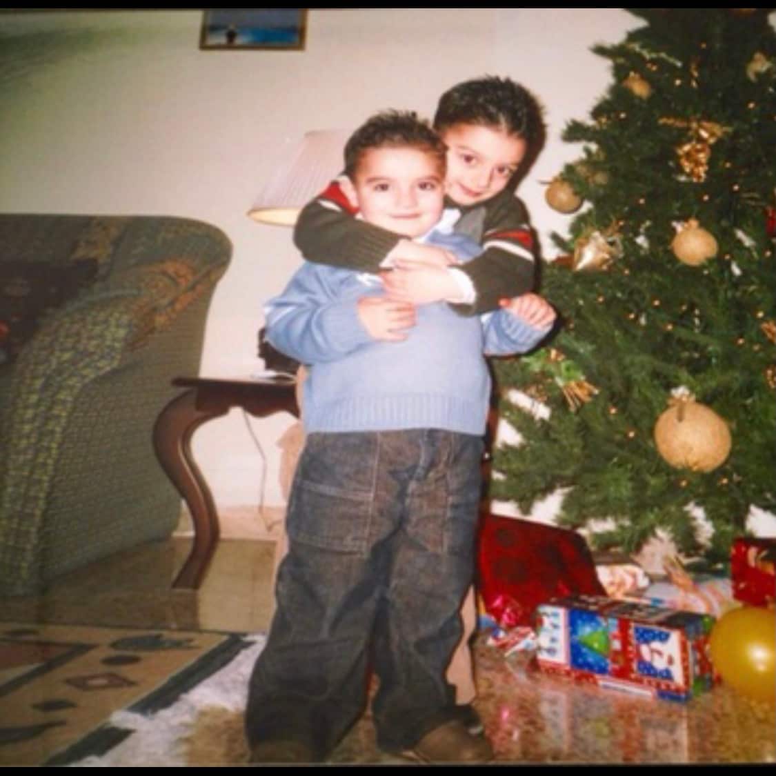 Fadi Abo as a child with his older brother in Syria.