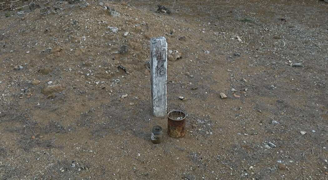 The curved corners ensure negative winds or energy flow around child's grave - A young child is buried with a simple headstone with the belief that she may return to this world because she was taken too young. (SBS)
